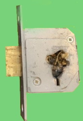 ANOTHER DRILLED OUT LOCK BY A COWBOY SO CALLED LOCKSMITH.